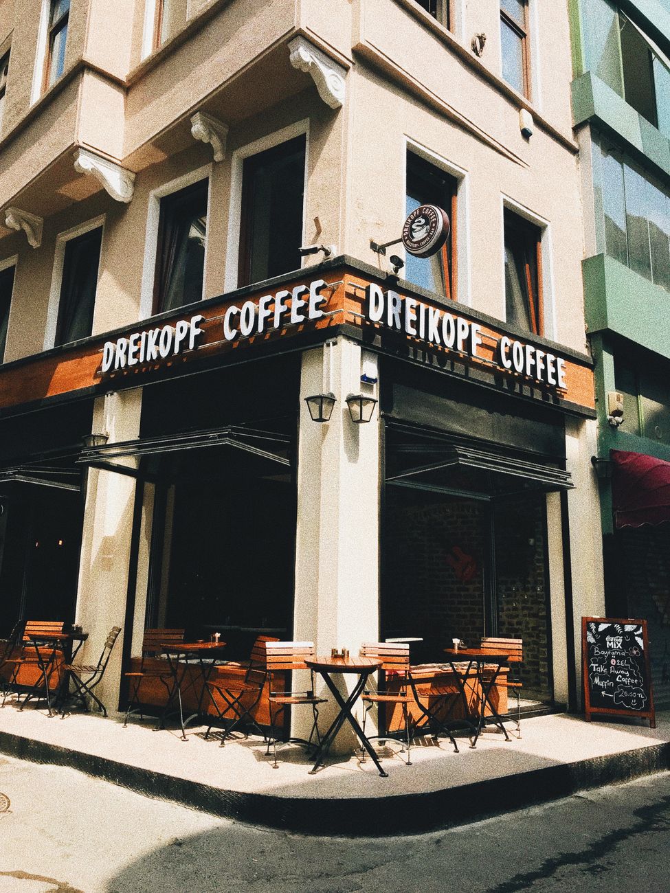 empty tables and chairs outside an establishment